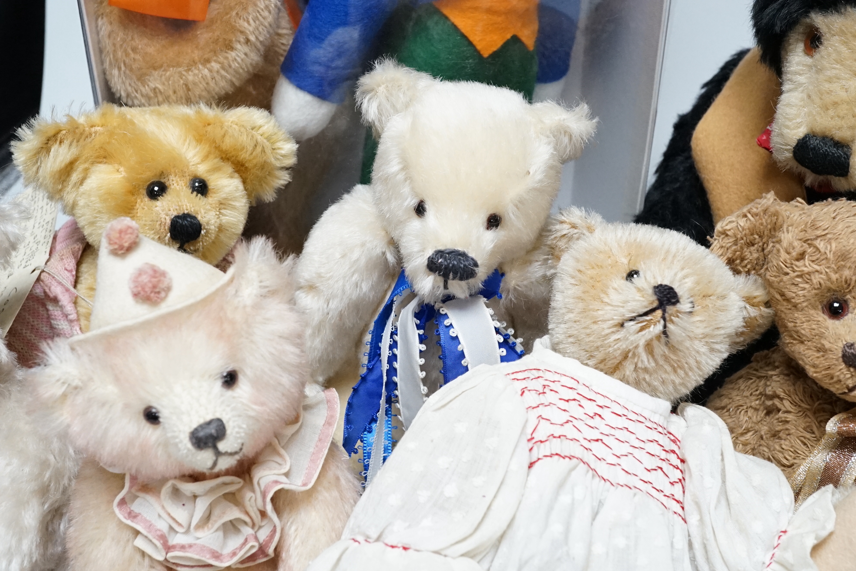 A Merrythought teddy and golly, boxed, with five artist's bears